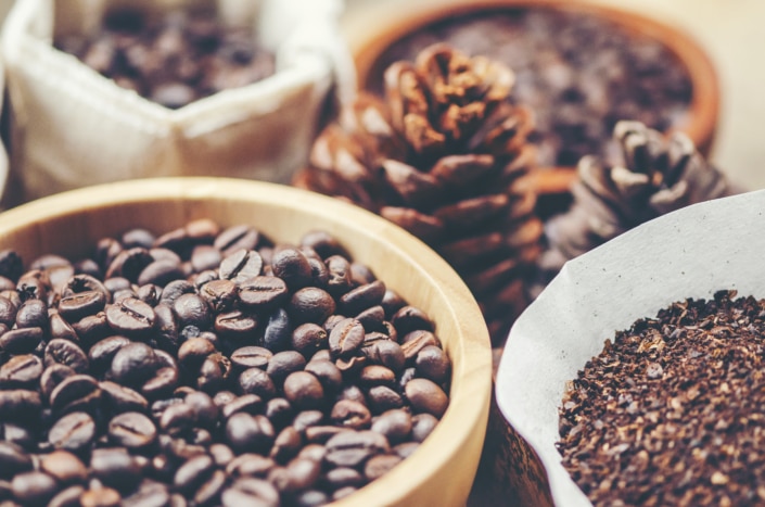 coffee beans on wooden background, arabica coffee, vintage filter image